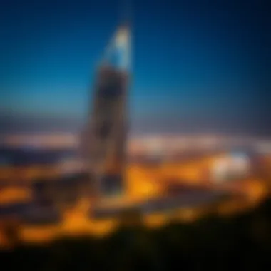Night view of Arc Tower C illuminating the Dubai landscape