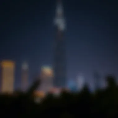 Damac Tower Illuminated at Night Night view of Damac Tower illuminated, symbolizing Dubai's vibrant nightlife