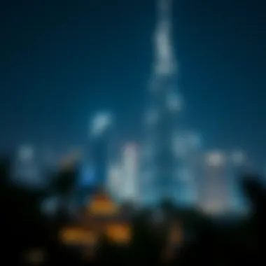 Night view of Dubai Palm Tower illuminated against the skyline